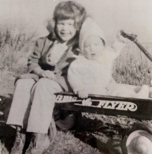 Sitting with my sister Barbara in our Radio Flyer